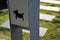 Detail of placement of dogs excrement bags in a metal post symbol dog  pedal road made of concrete tiles and chipped granite tiles