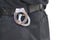 Detail of police officer utility belt with cuffs