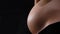 Detail of a pregnant woman`s belly