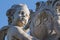 Detail of the Putti Fountain in Pisa, depicting the face of a small angel