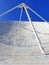 Detail of radio telescope under blue sky. Observation instrument used in radio astronomy. Antenna to capture the Universe