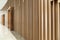 Detail of Random wooden strip wall in vertical direction at pre-function space / interior / natural light