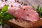 Detail of raw pork meat with salt and color pepper on chopping board