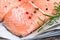 Detail of Raw Salmon Fish Fillet with Spices and Fresh Herbs