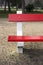 Detail of red painted park bench