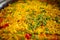 Detail of the rice in a fish paella. Spanish typical food