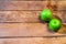 Detail on ripe green apples on wooden table