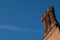 Detail of rooftop ornament red brick chimneys in Tudor architect