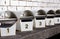 Detail of a row of white metal letterboxes