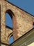 Detail of the ruins of a Gothic monastery, stone masonry with a typical Gothic arch