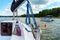 Detail of a sailboat deck with a winch and nylon ropes