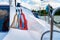 Detail of a sailboat deck with a winch and nylon ropes