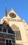 Detail of Saint Peter`s Church and a brick ancien house on a sunny day, Leuven, Belgium