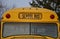 Detail of school bus from america yellow color front view of window lights and bus sign in letters