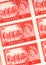 Detail from a sheet of vintage mint five shilling postage stamps from the UK.