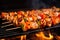 detail shot of sizzling, marinated chicken pieces on skewers