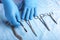 Detail shot of sterilized surgery instruments with a hand grabbing a tool ,