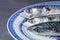 Detail shot of three mackerel heads on a white and blue plate, on gray background in horizonta