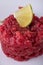 Detail of single portion of beef tartar steak_