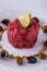 Detail of single portion of beef tartar steak with capers