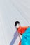 Detail of snowboarder on piste