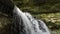 Detail stationary shot of waterfall up close into gorge