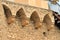 Detail of the stone arches supporting the defense corridor of the castle.