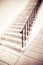 Detail of a stone staircase whit iron banister - toned image