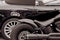 Detail stylish black car and motorcycle. Lifestyle. (Opposites,