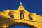 Detail of the sunlit colonial arch `Arc de San Juan` in the historic center of Merida, Mexico