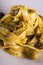 Detail of tagliatelle with pesto and capers