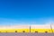 Detail of temporary concrete barricade walls on a newly paved road  with blue sky and copy space