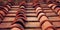 Detail of terracotta roof tiles. Aged photo.