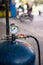 Detail of tire Inflator in gas station, old air pressure tank with guage and valve used to put air into the tire