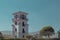 Detail of a tower of museum of costarican art in the capital of san jose on a sunny spotless cloud. White tower is seen rising up