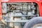 Detail of tractor machine or engine. Whit visible fuel pump, engine starter,