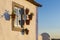 Detail of a traditional house painted in white and blue, with a window with pottery vases