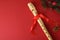 Detail of traditional plastic recorder on red with Christmas decoration