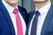 Detail of two businessmen standing next to each other