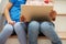 Detail Of Two Girls Sitting On Stairs Using Digital Tablet