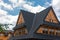 Detail of Typical houses or villas in Zakopane, a known polish summer and winter retreat place. Main road and wooden houses next