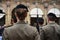 Detail with uniformed women standing during the military ceremony in Bologna, Italy.