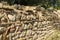 Detail of unusual ancient greek rock wall design and pattern near the Leonidaion in Olympia Greece