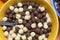 Detail of vanilla and chocolate cereal balls in a bole