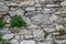 Detail view of an ancient stone wall in the village of Borgo Cervo in liguria Italy. Useful as a background