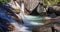 Detail view of cascading waterfall in a lush stream. The Cold Creek Waterfalls in High Tatras National Park, Slovakia, Europe.