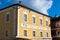 Detail view of the Mondsee town hall with a yellow facade. Mondsee, Upper Austria.