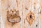 Detail view of old wood front door with door knocker and ornated keyhole