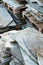 Detail view of stone granite and slate roof tiles ready for putting onto a house roof