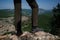 Detail of vintage leather boots and unrecognizable adventurous female hiker